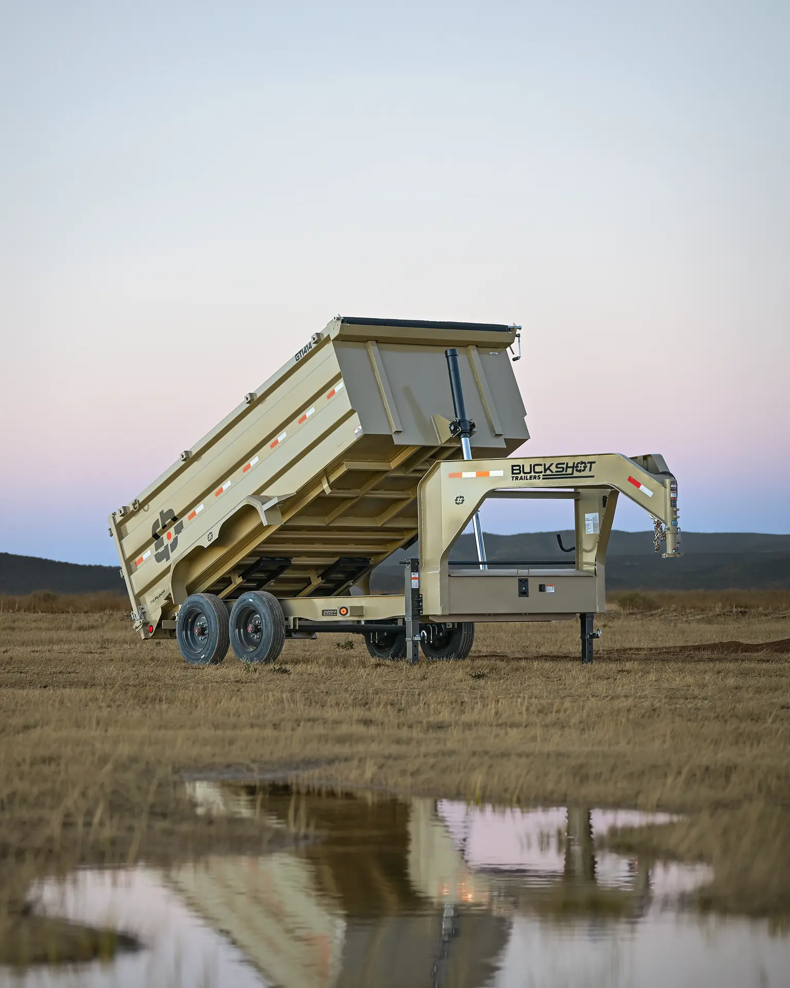 Buckshot GTI Series gooseneck dump trailer with 7K axles, represented by the GTI 414