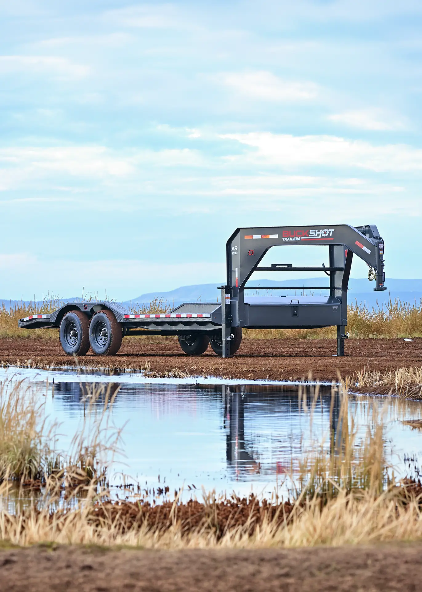 Buckshot AR-D Series gooseneck dovetail equipment trailer with 7K axles