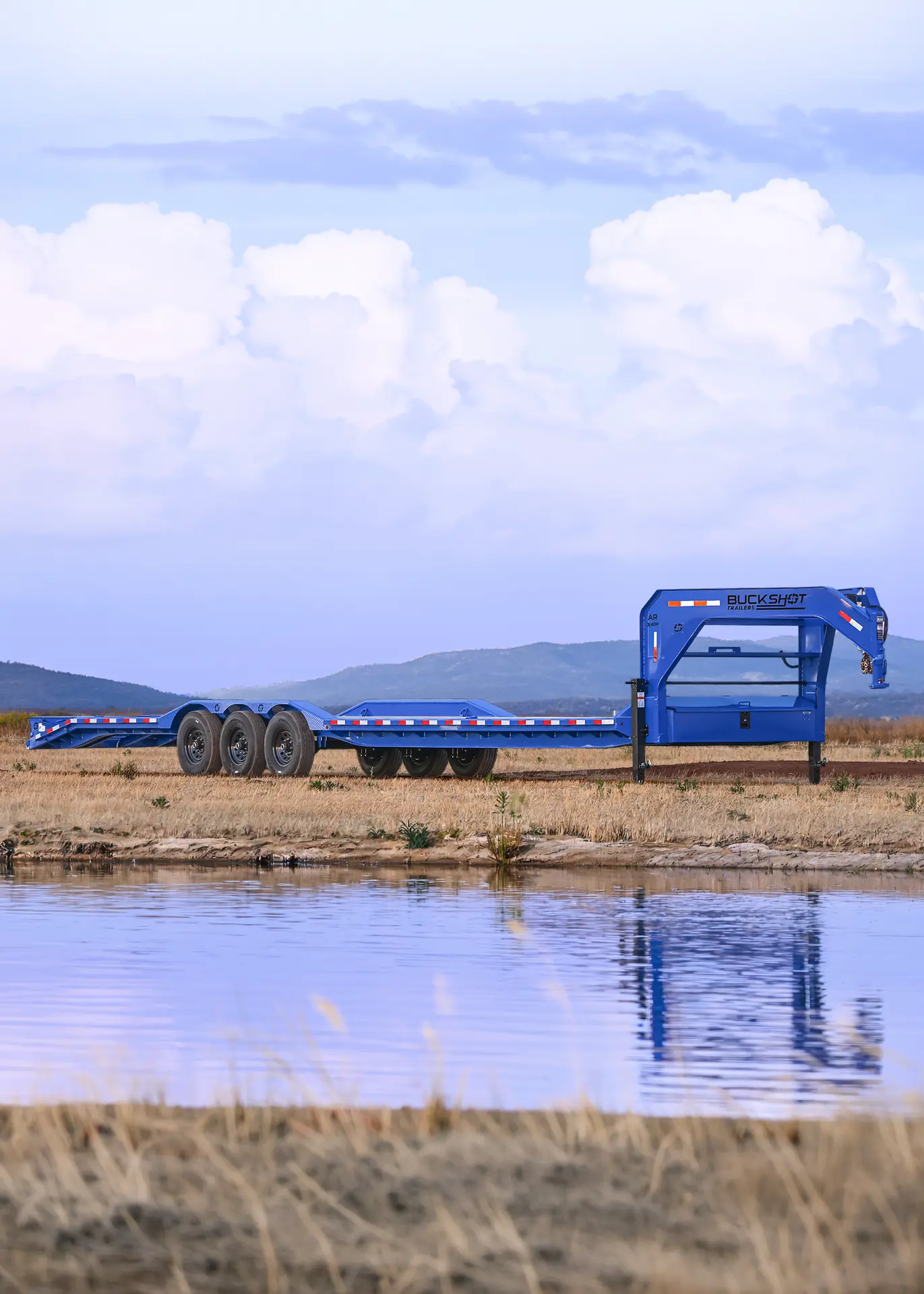 Buckshot AR-XR Series gooseneck equipment trailer with AR Mega Ramps and triple 7K axles