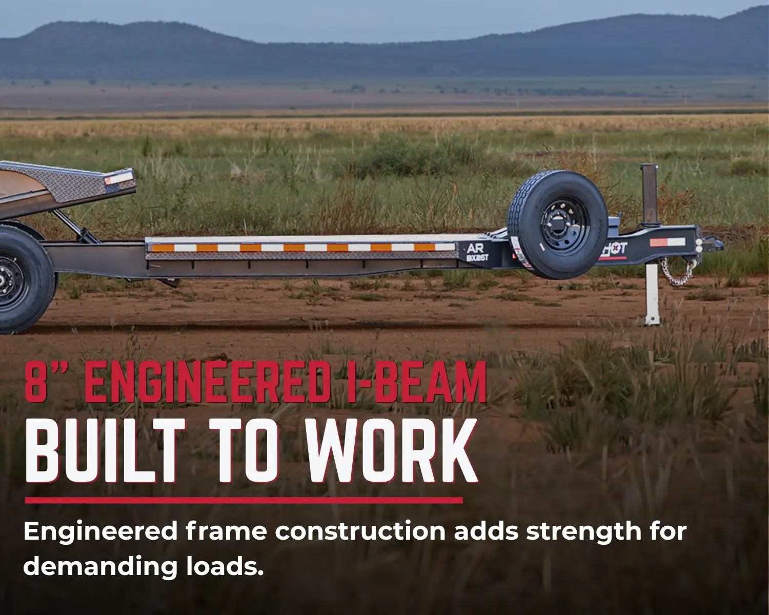 AR B-XT triple axle gravity-tilt deck lowered for equipment loading