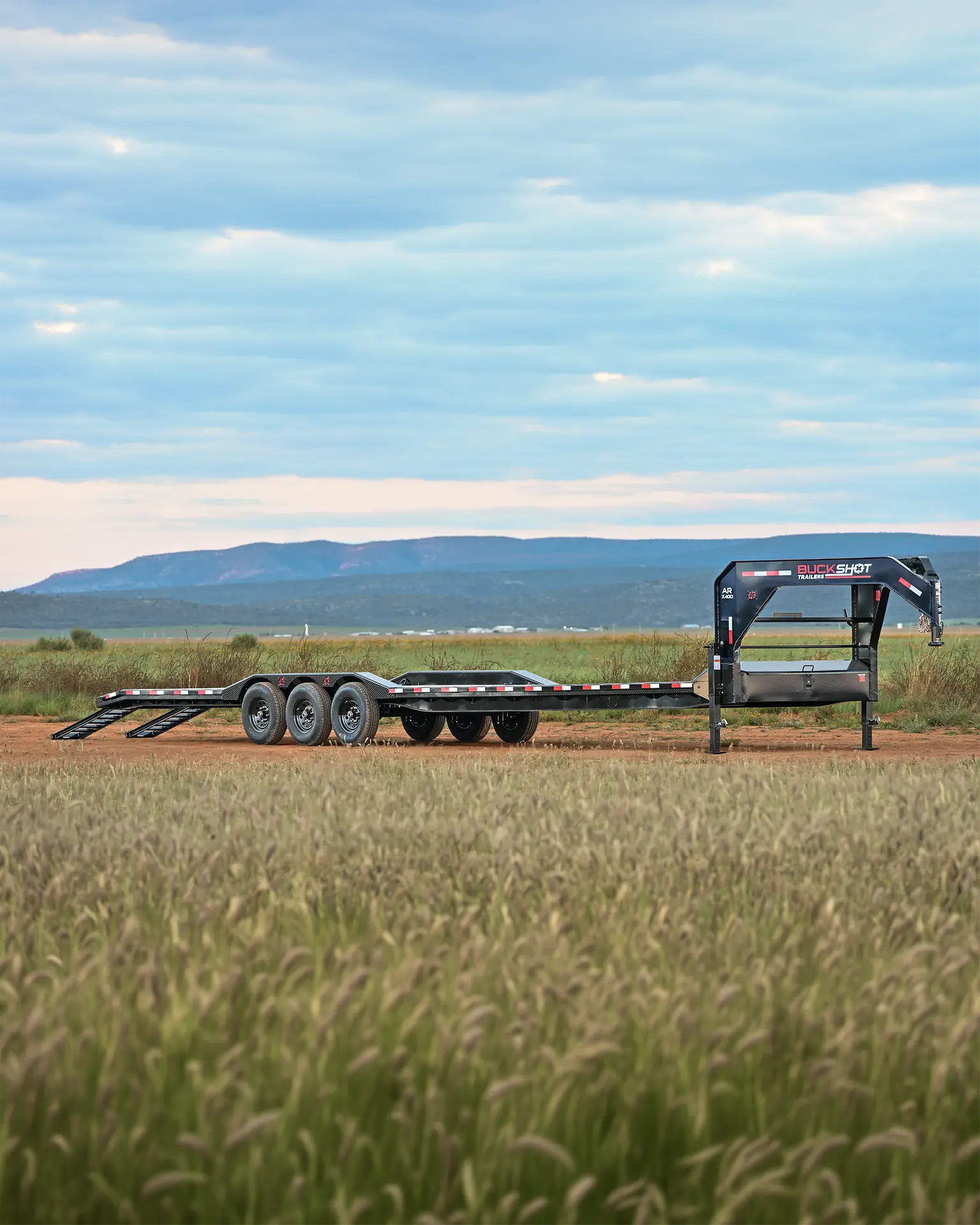 Buckshot AR-XD Series triple-axle gooseneck dovetail equipment trailer